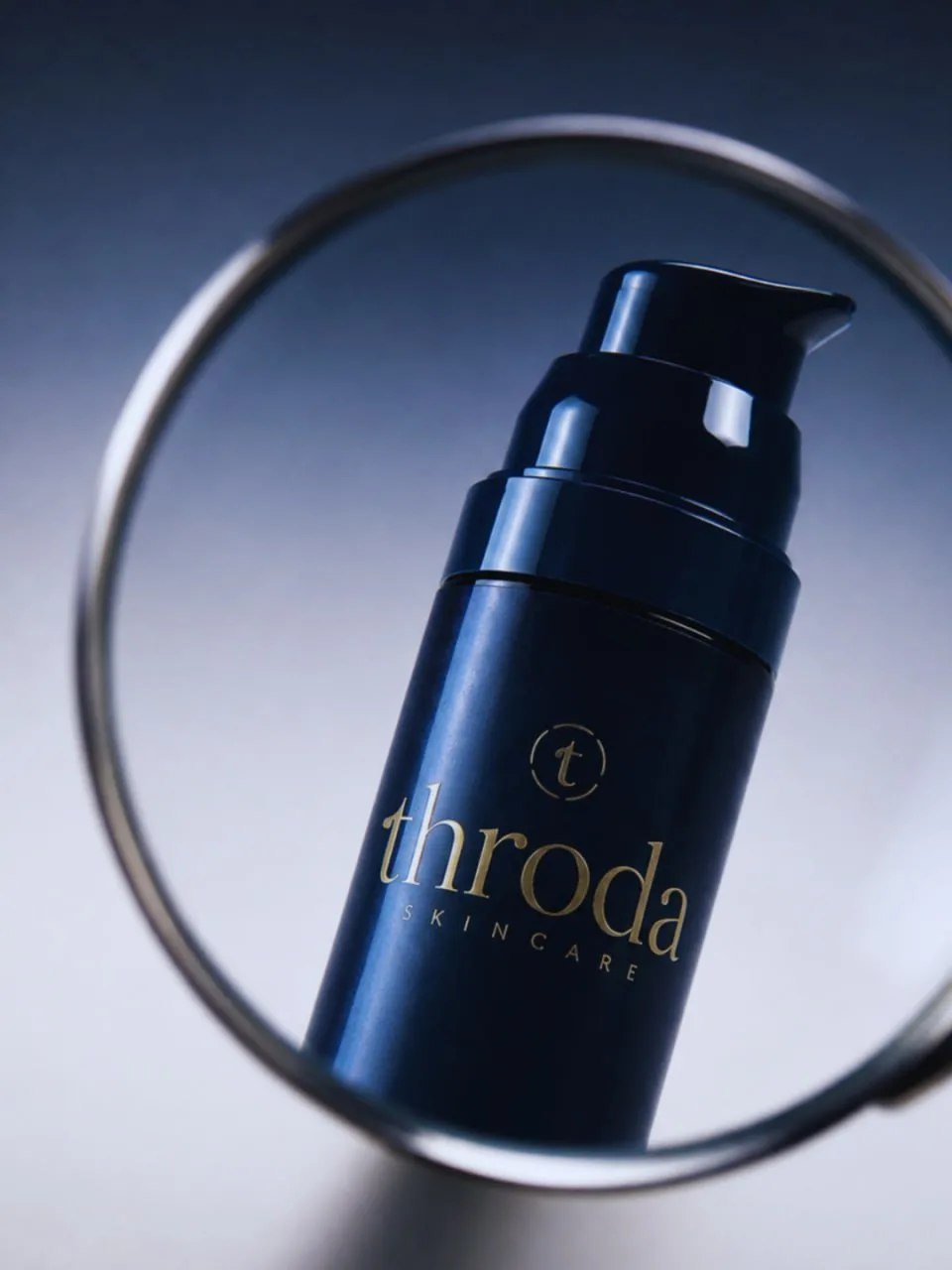 The Face Barrier Serum framed through a glass ring