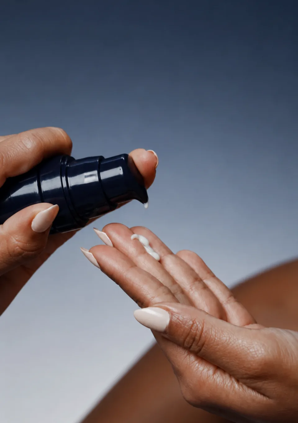 The Face Barrier Serum being pumped into an open palm